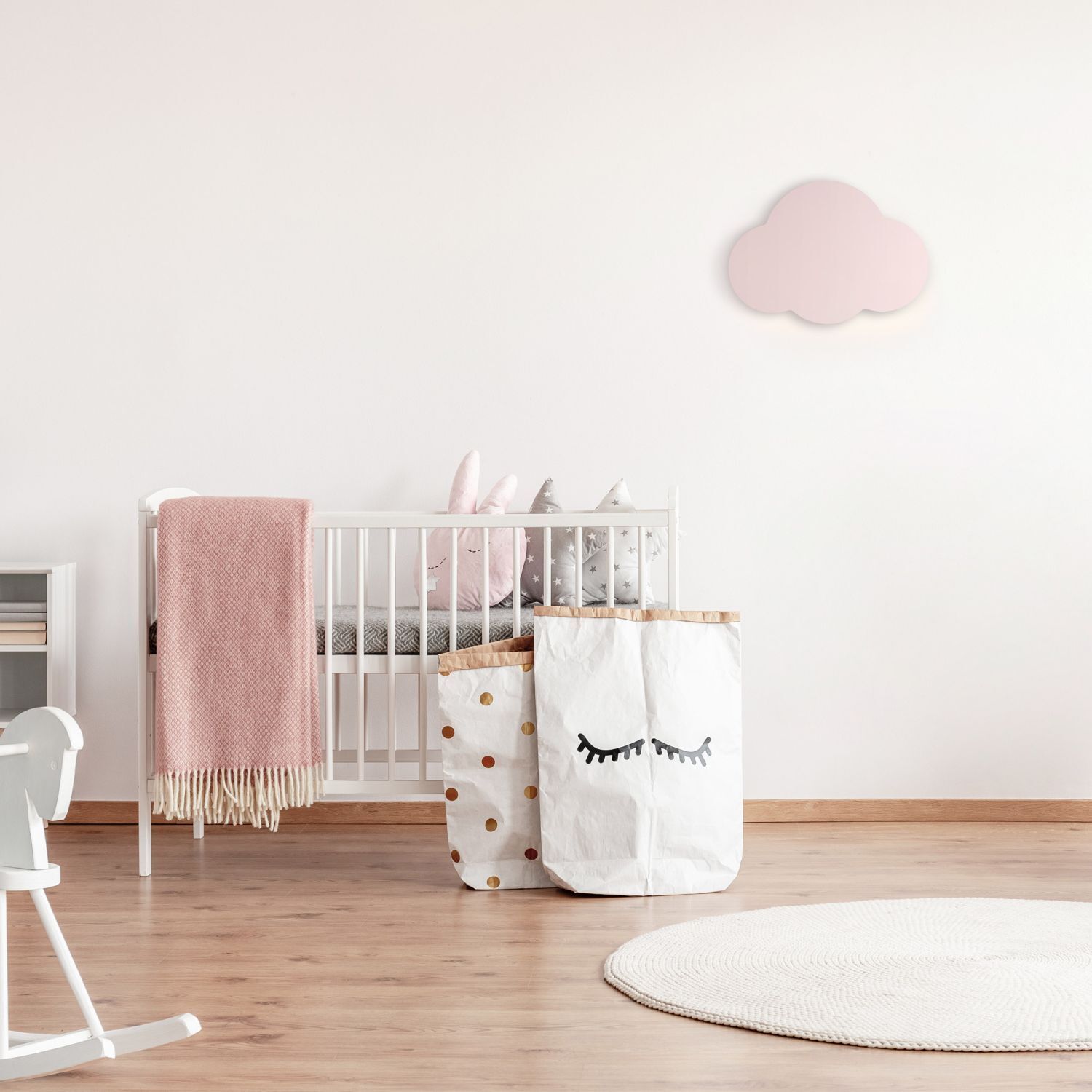 baby room, crib, pink blanket, storage bag, cloud decor